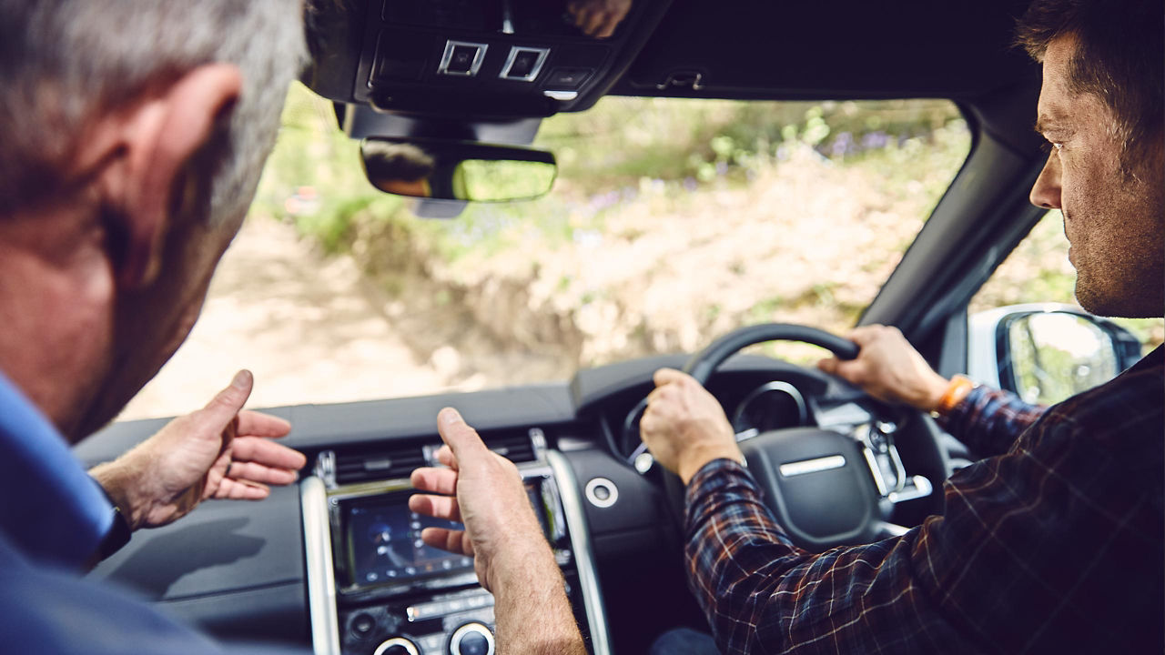 Men Having Driving Lesson With Instructor