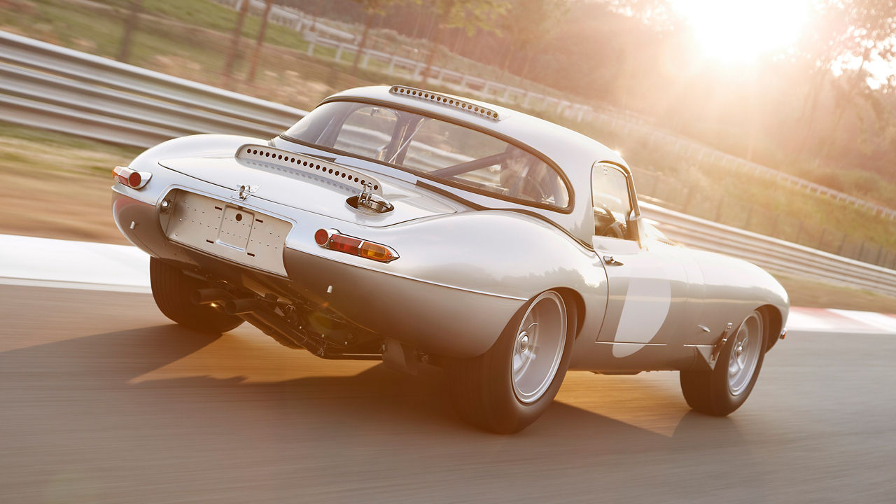 Jaguar E-Type running on the racing track road