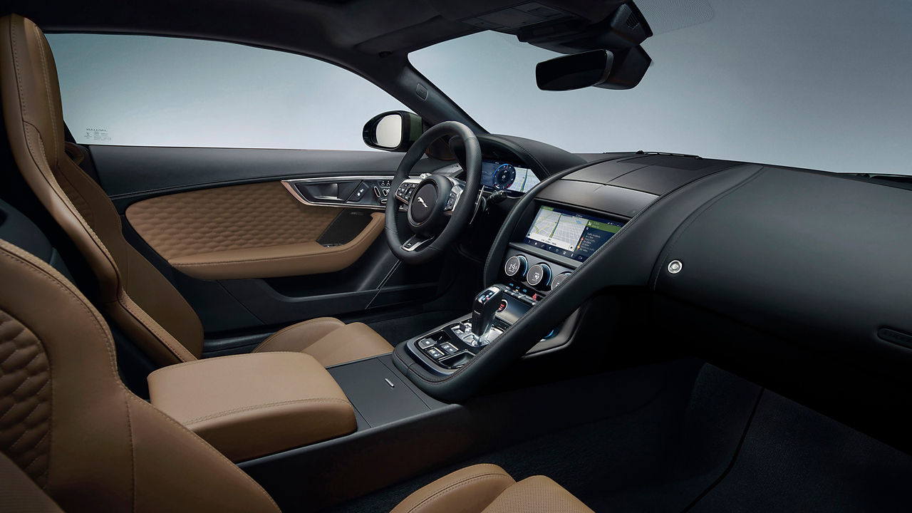 Jaguar cabin dashboard, player, steering wheel, gear shift handle, buttons and seat