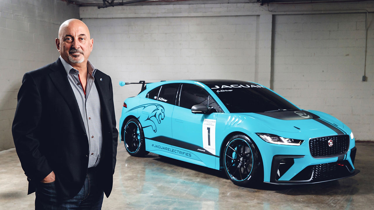 Rahal standing beside of Jaguar I-Pace Etrophy