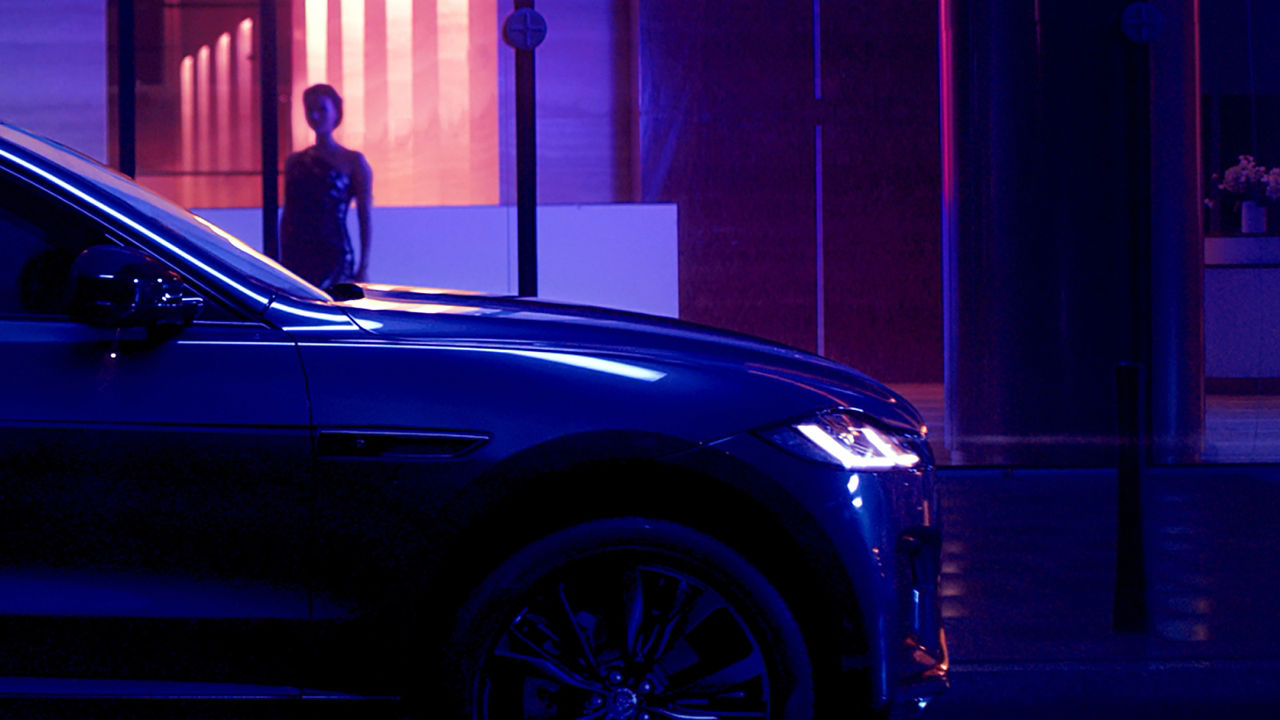 A woman staring at Jaguar from outside
