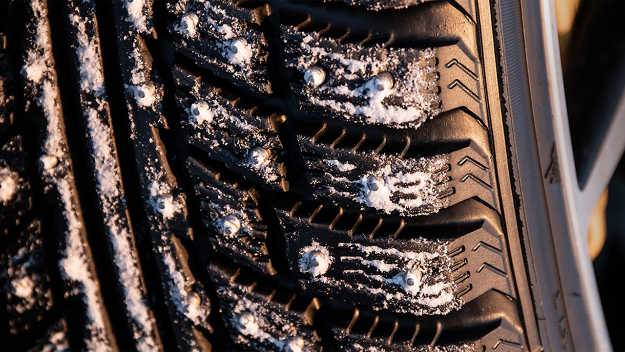 An icy tyre of a Jaguar F-TYPE