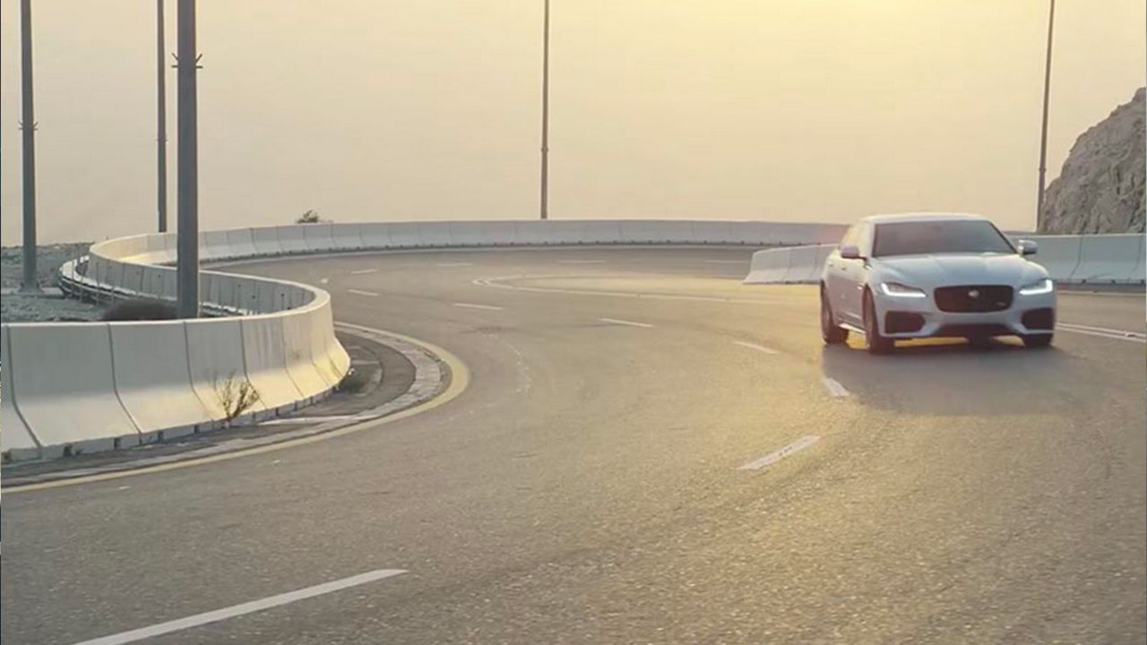 Jaguar XF passing through mountain routes