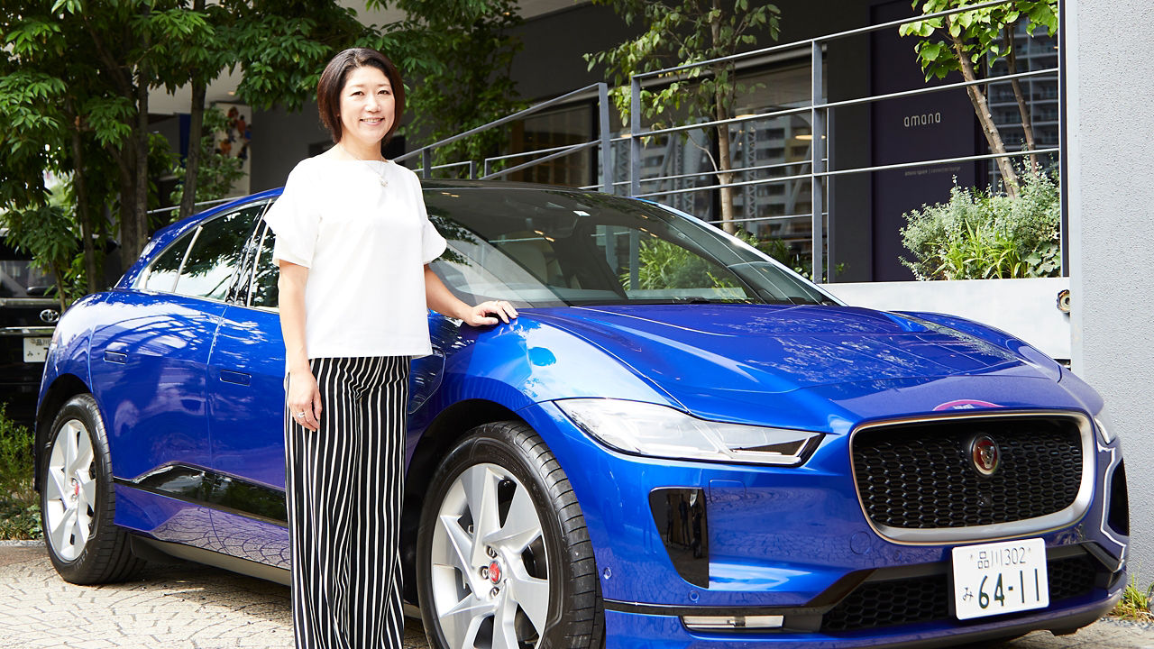 Kumi Sato  posing with Jaguar I-Pace