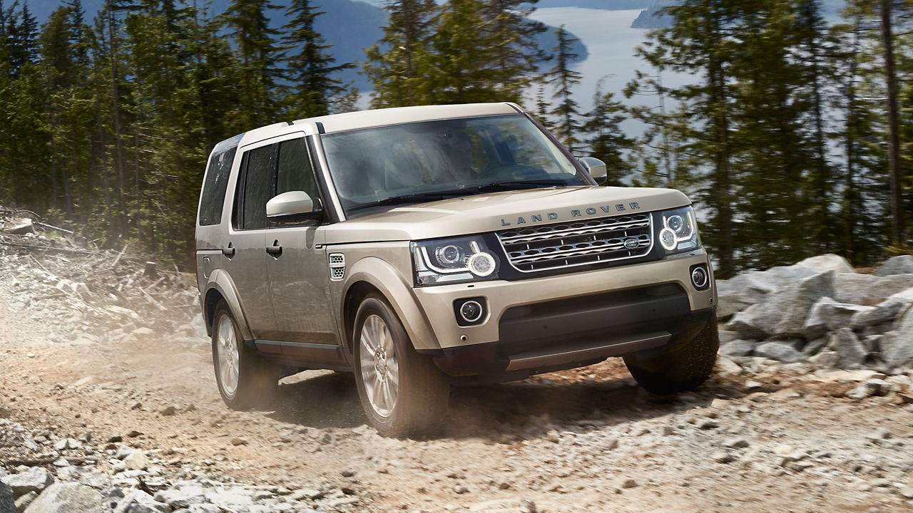 Land Rover moving on a hilly mountain road