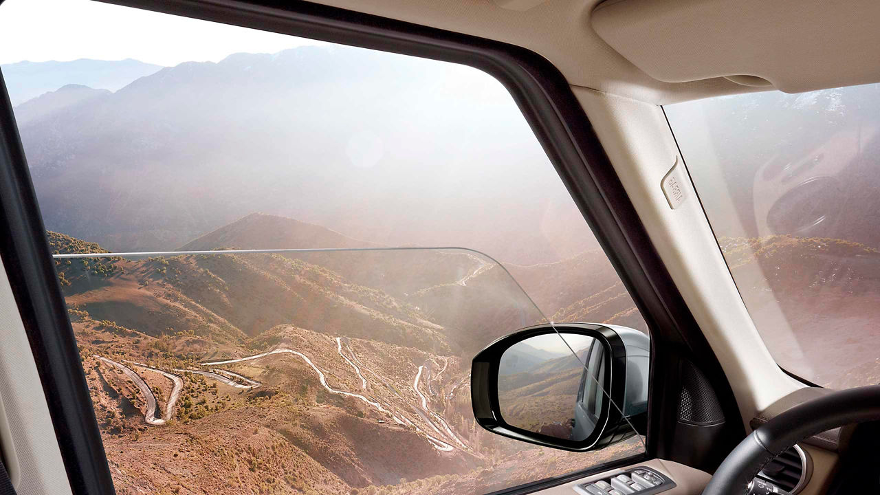 View from driver's seat over the winding road in the mountain