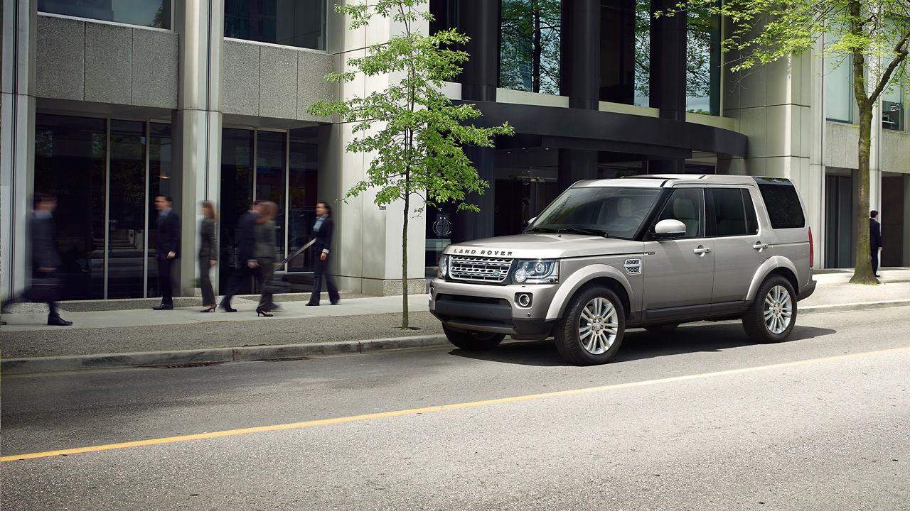 Parked Land Rover Outside Of The Building