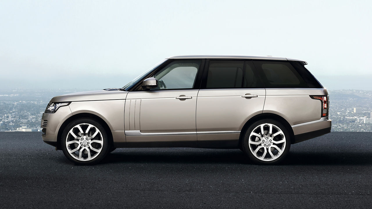 Parked Range Rover on Asphalt road side view