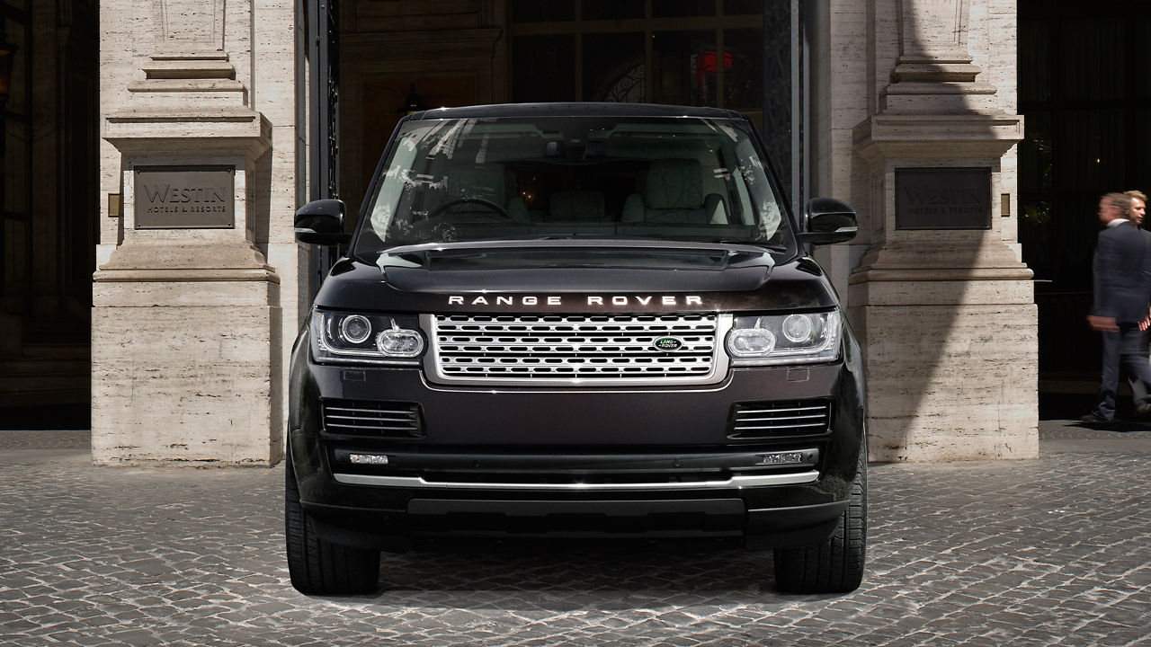 Parked Range Rover in front of building