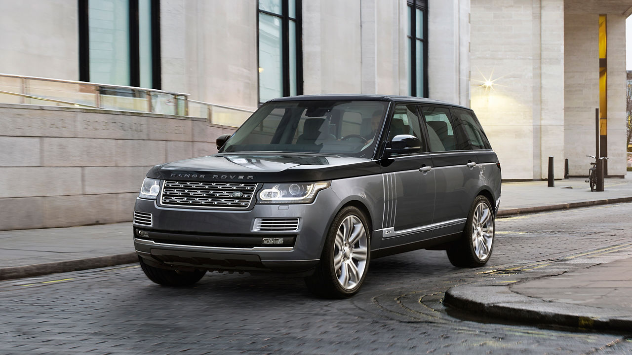 Range Rover traveling on city road