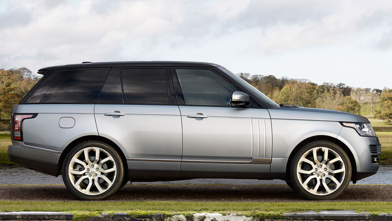 Land Rover Side view  parked on beach