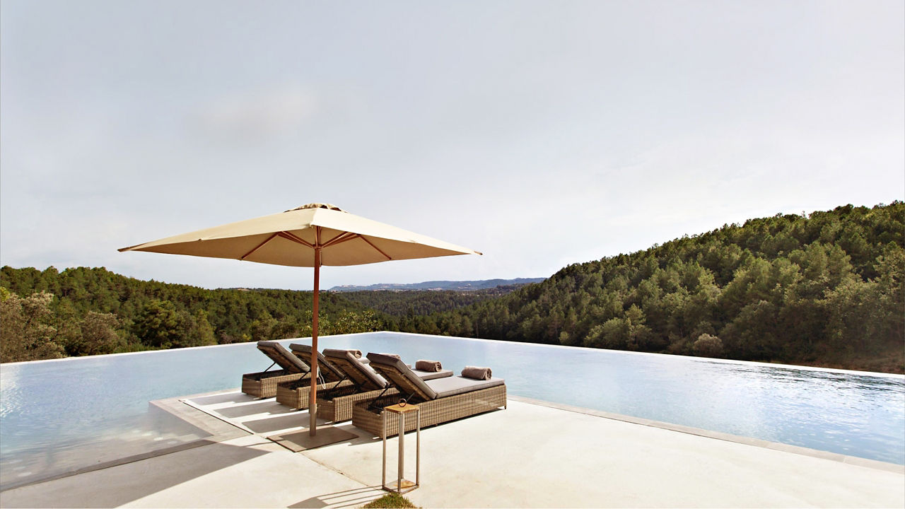 Inifinity Pool with Beach Beds overlooking the mountains