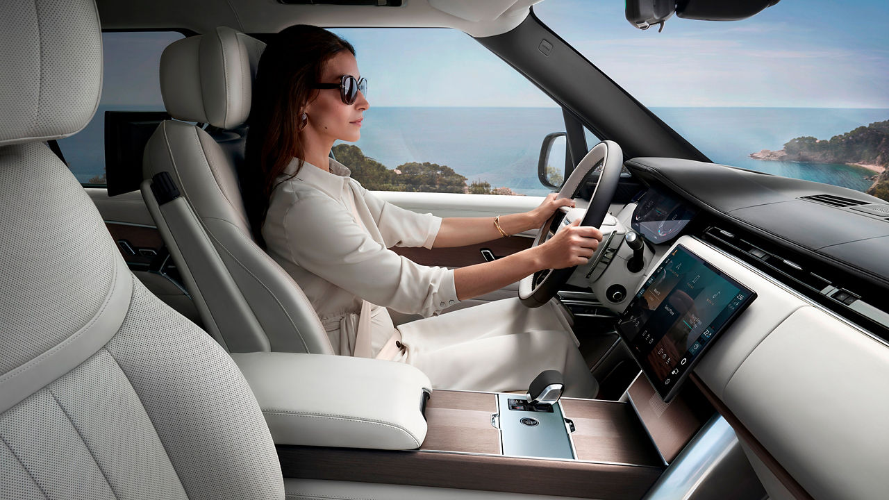 Stylish women inside Range Rover