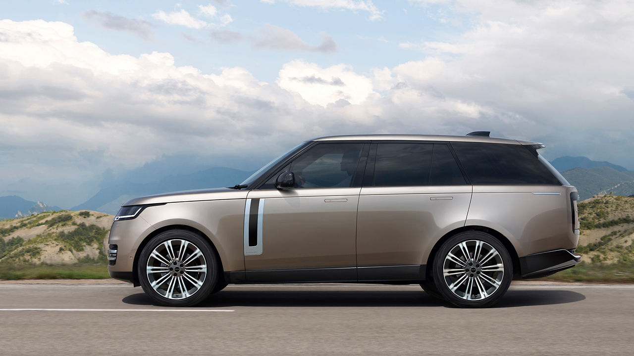 Range Rover driving on road