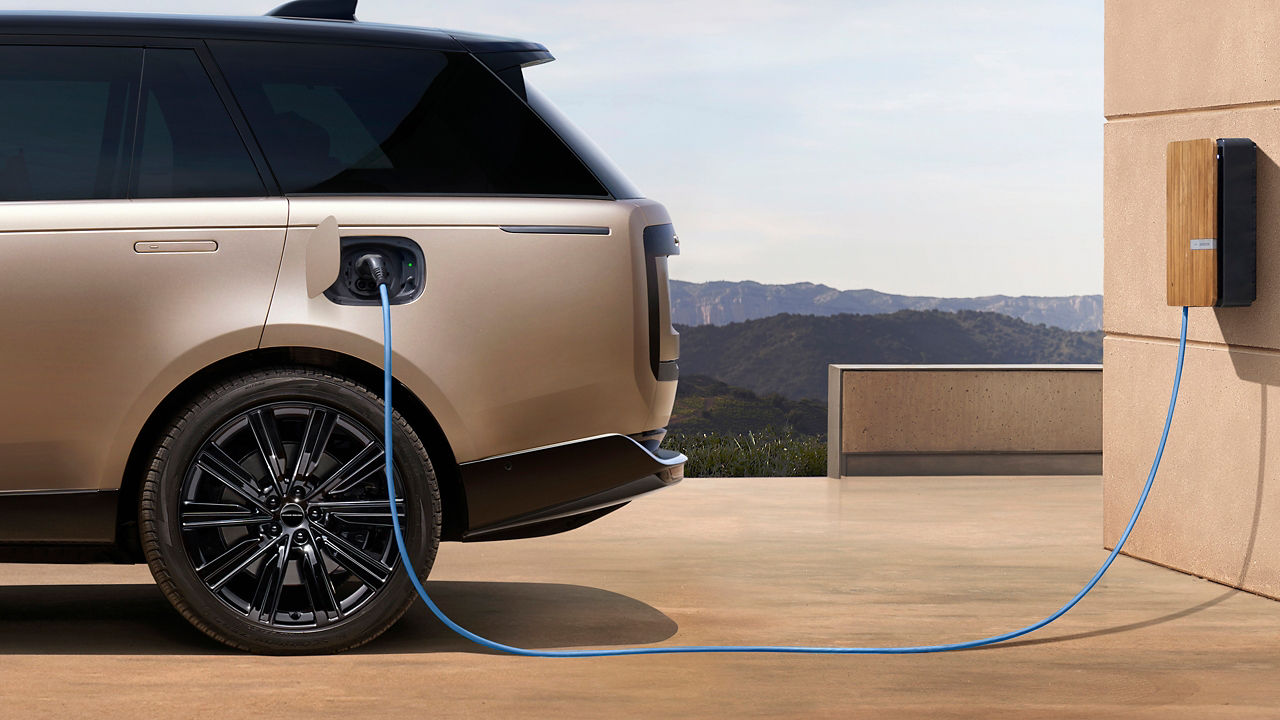 Range Rover parked in EV station