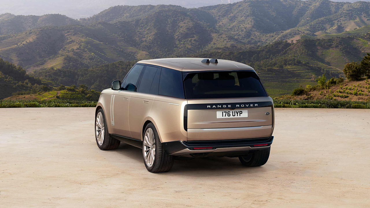 Range Rover SV in gold back side view