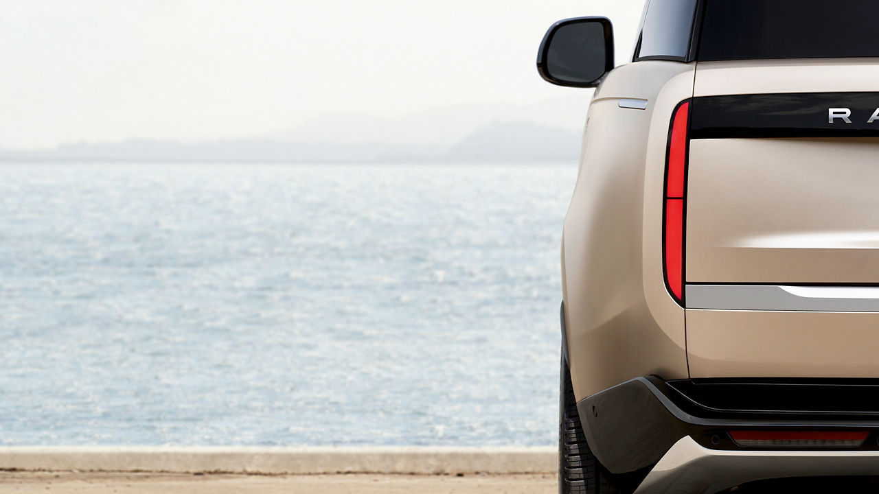 Rear view of Range Rover parked near sea side