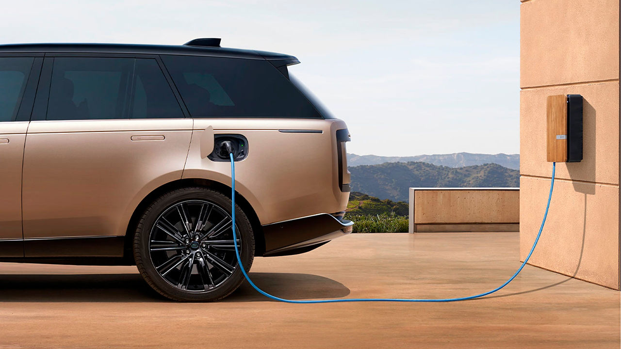 Range Rover  charging  in front of house