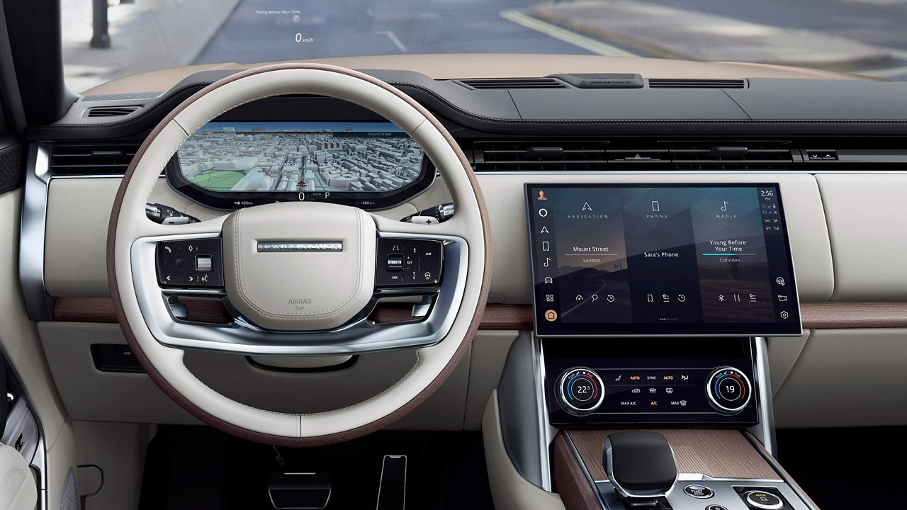 The steering wheel and centre console inside the New Range Rover