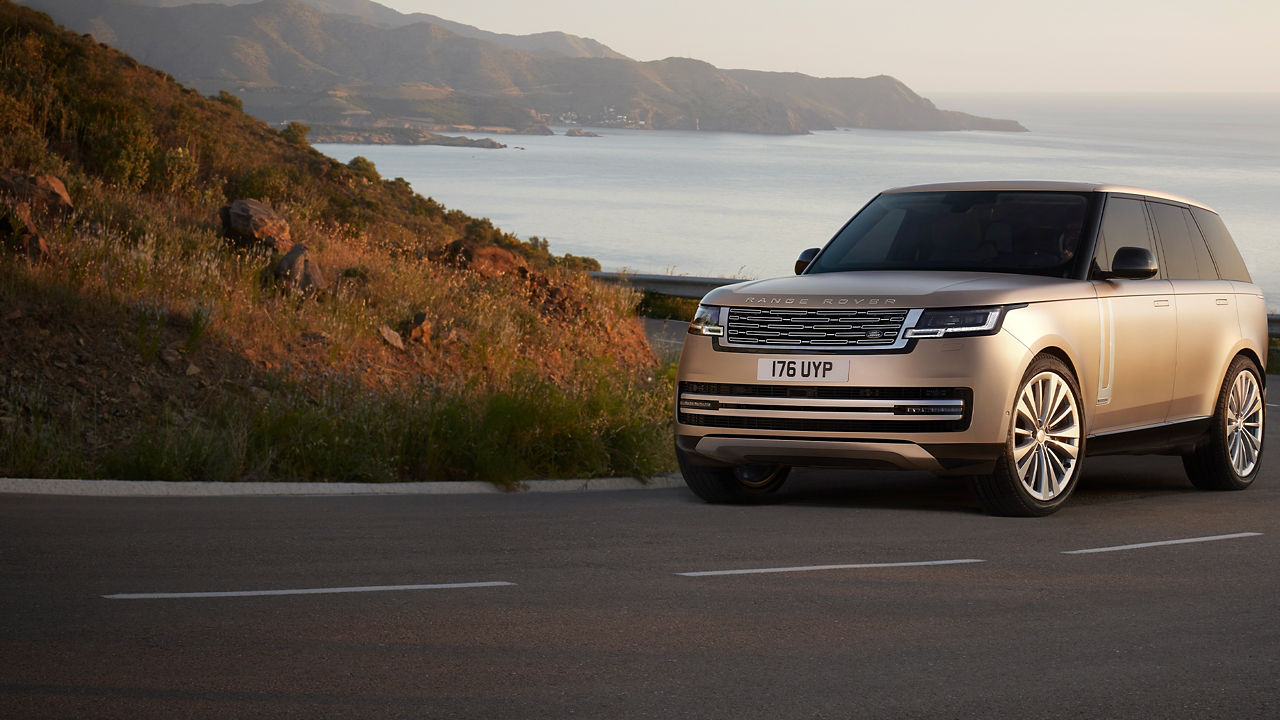 Range Rover Driving on the lake side road