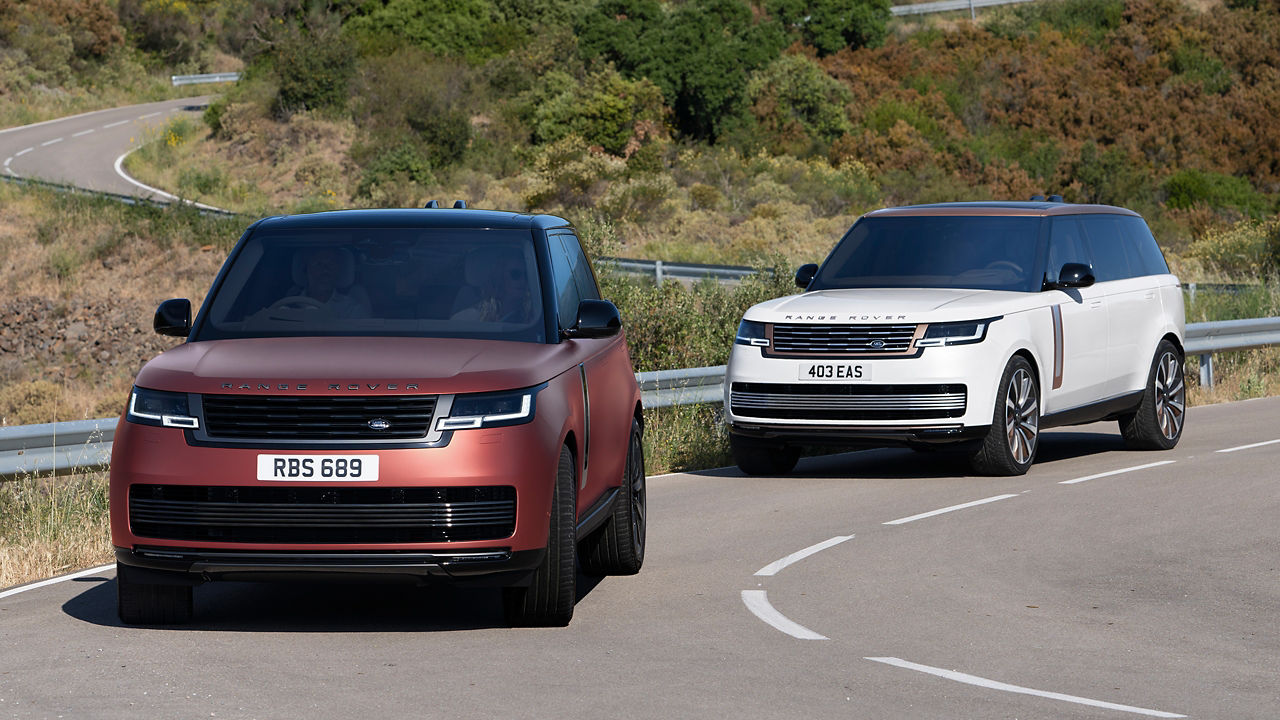 Two Range rover climbing on road