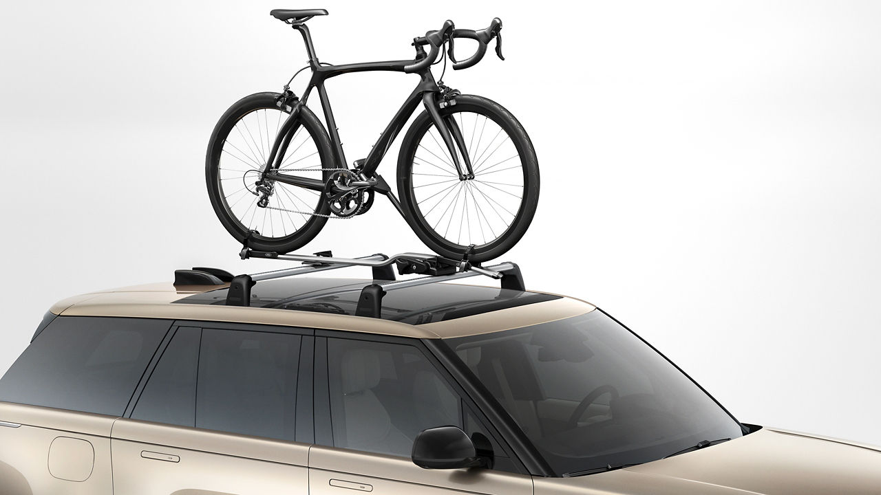 Wheel mounted bike carrier on car roof