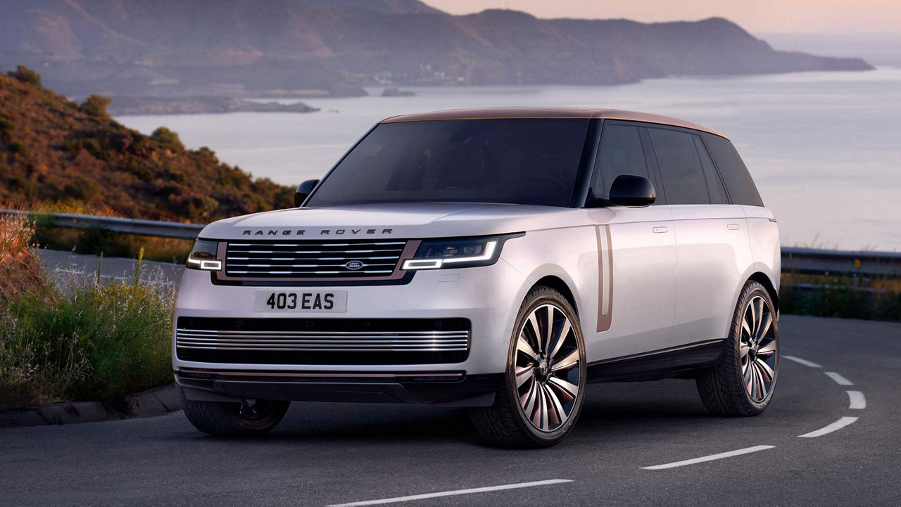 New Range Rover driving on river side off road