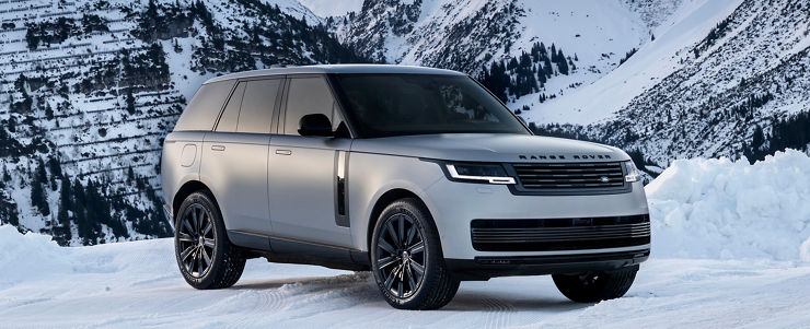 Range Rover SV Lech One of One in Arlberg Silver Satin at snowy mountain.