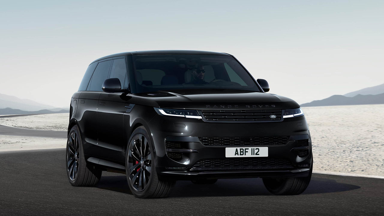 Range Rover Sport in Santorini Black driving on road.