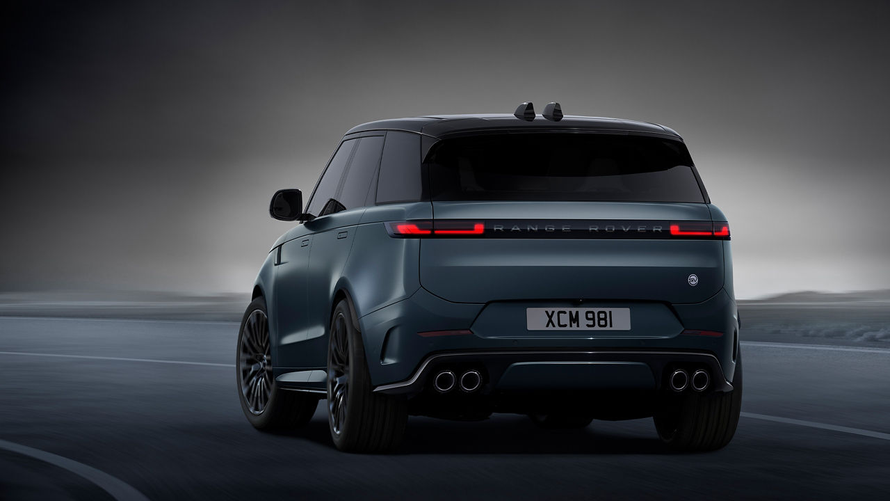 Range Rover sports standing on road back view