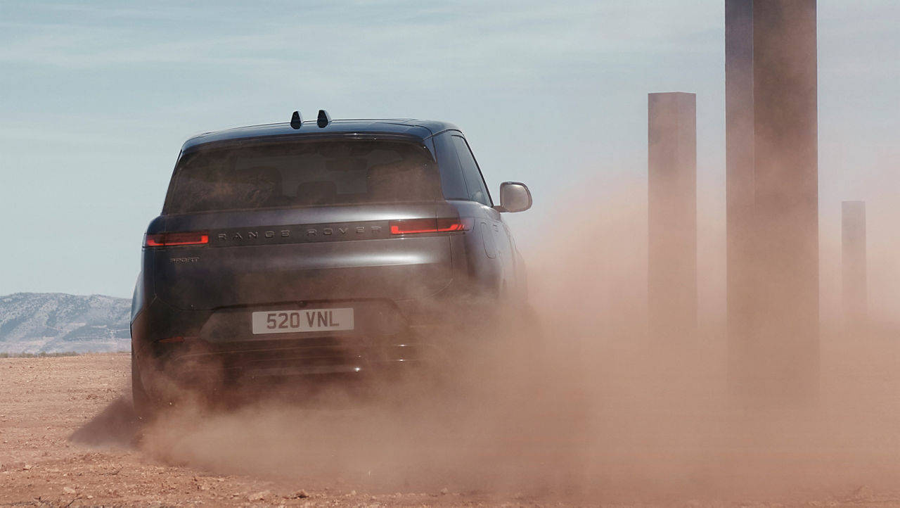 Range Rover Sports drifting on sand dust road