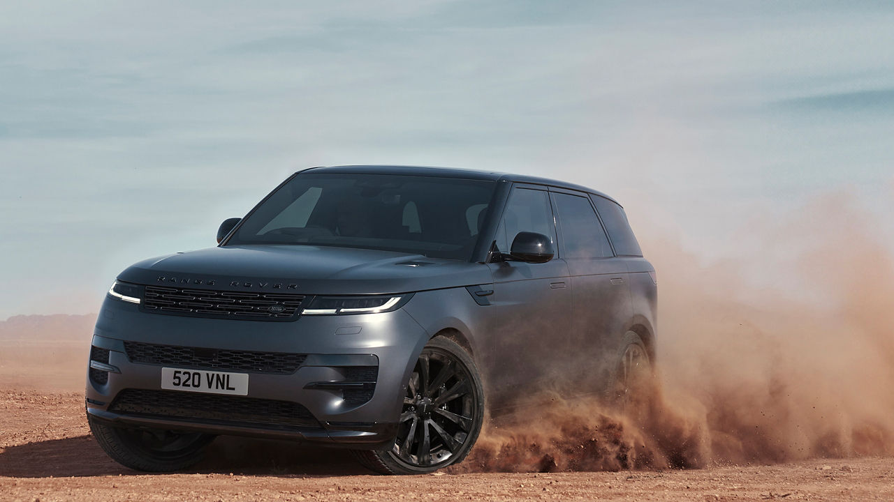 Range Rover Sports Drifting Over Sand Dust Road