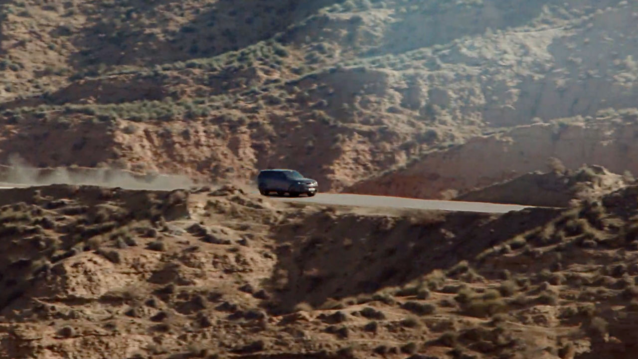 Range Rover Sports driving on the mountain hill road