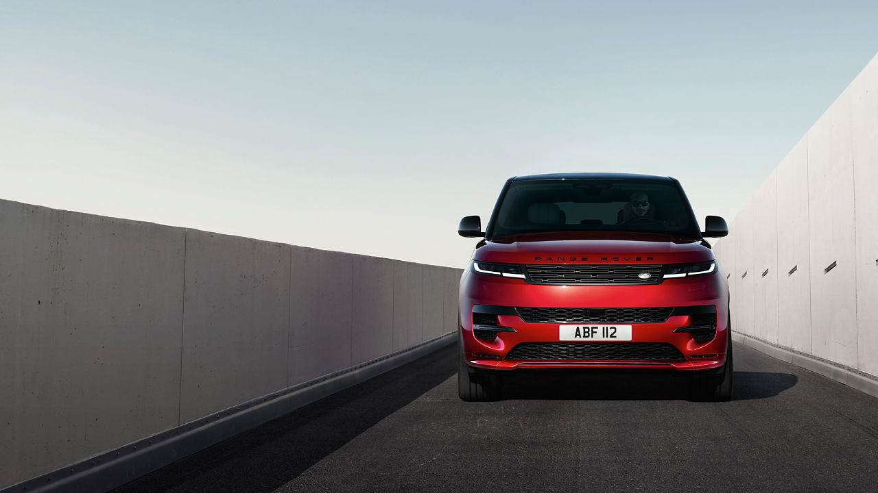 parked New Range Rover Sport middle of the road