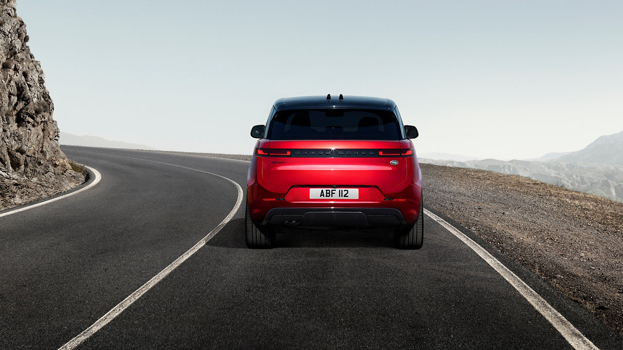 Range Rover sports up climbing on highway road