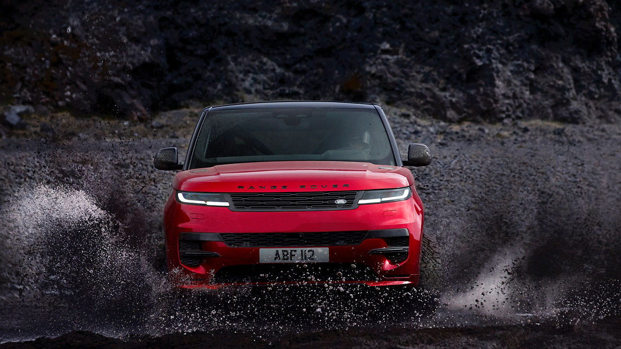 Range Rover Sport drifting over muddy off road