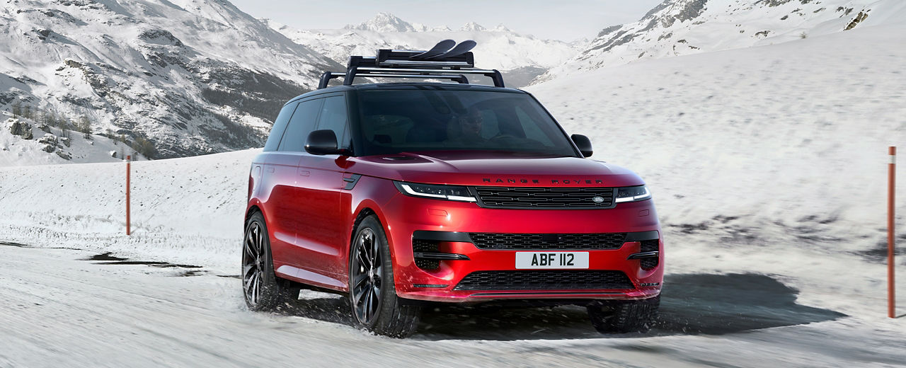 Range rover drifting over snowy mountain