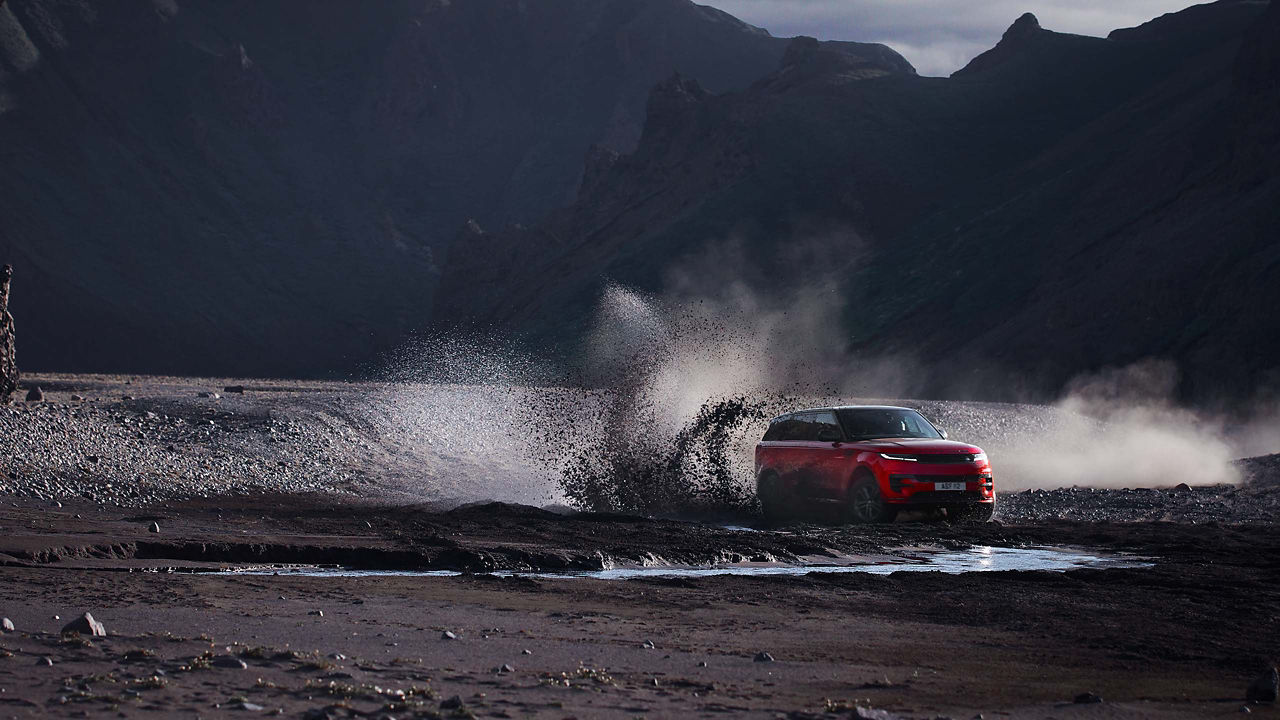 Range Rover Sport driving through mud in Iceland 