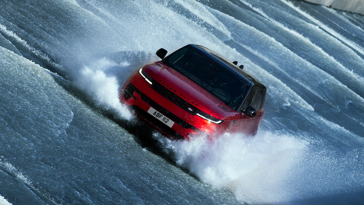 Land Rover parked on gravel in Iceland landscape