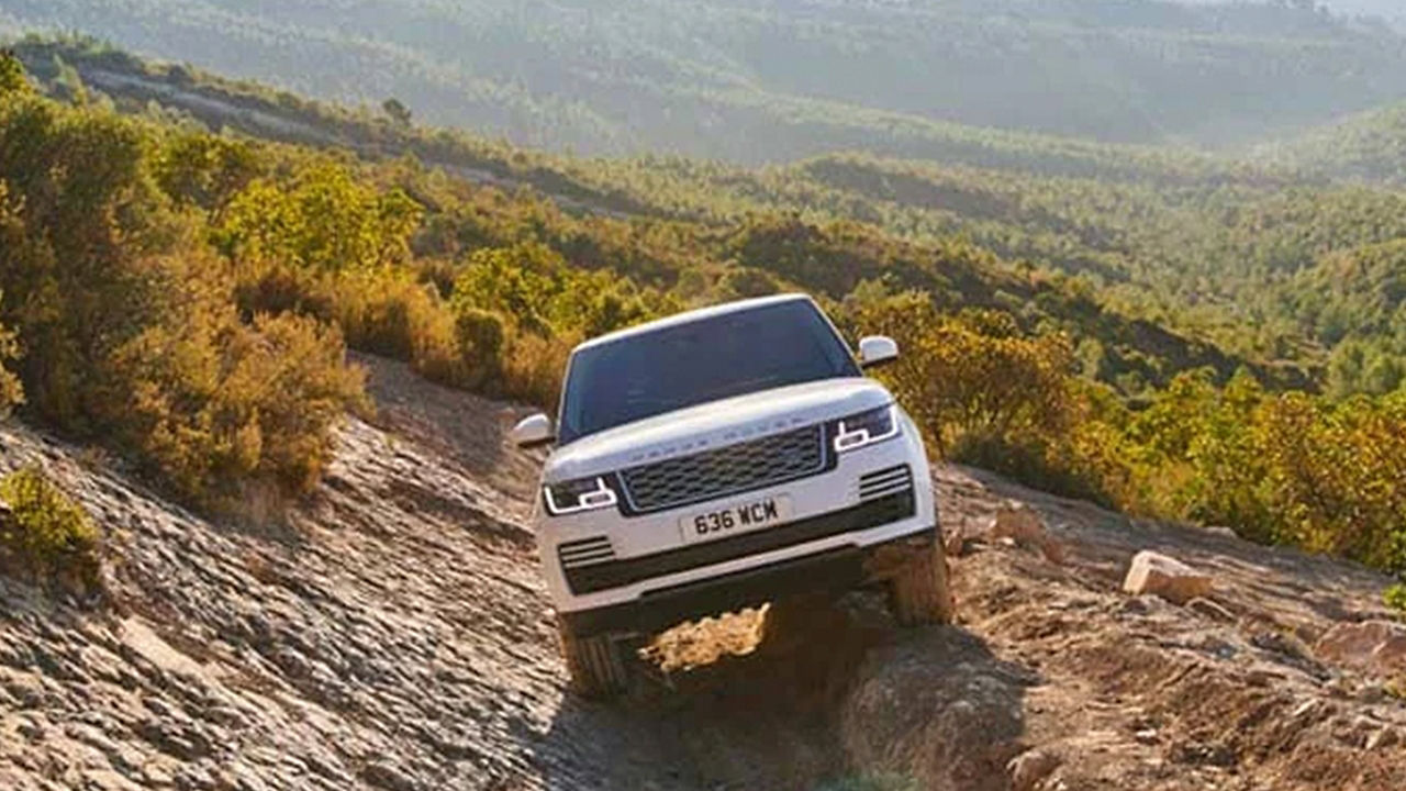 Range Rover Sports Driving On Mountain Runway Road