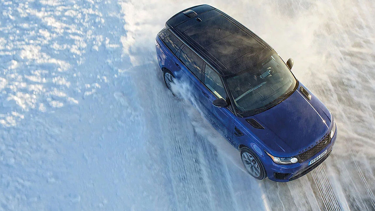 Range Rover Sport driving on snowy off-road