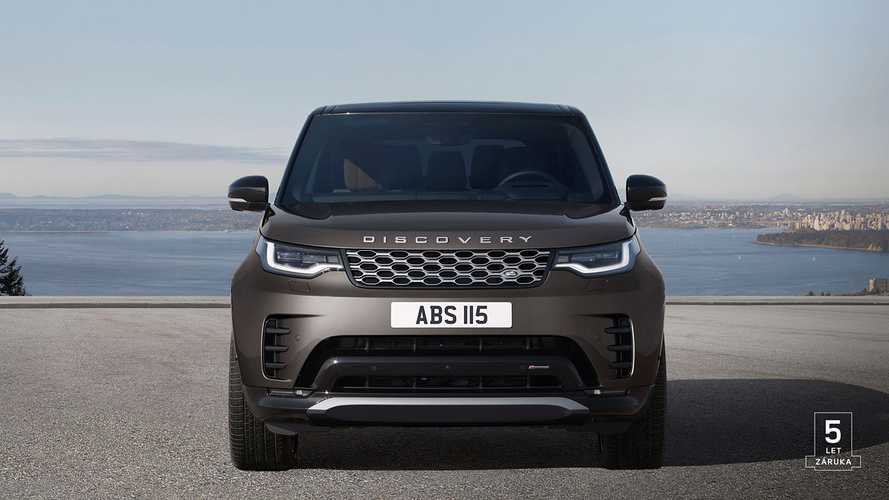 Front view of Discovery in Charente Grey parked outside with 5 years warranty watermark.