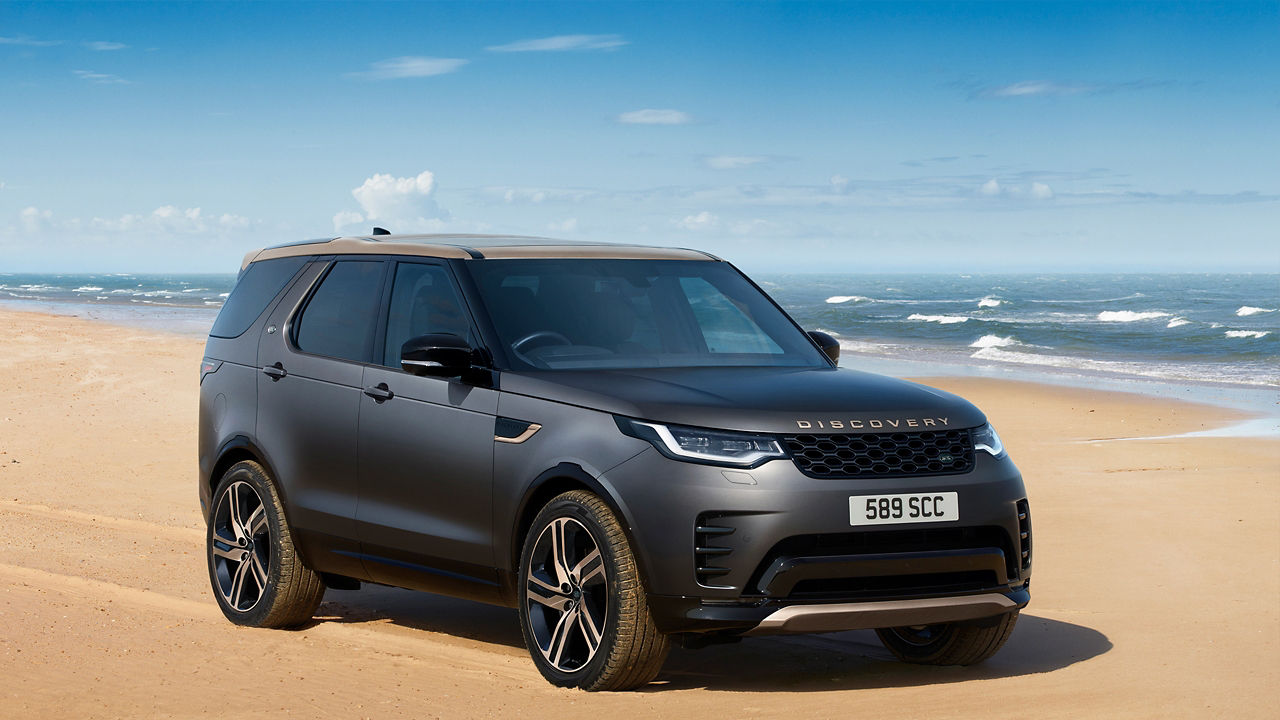 Discovery parked on seashore side view