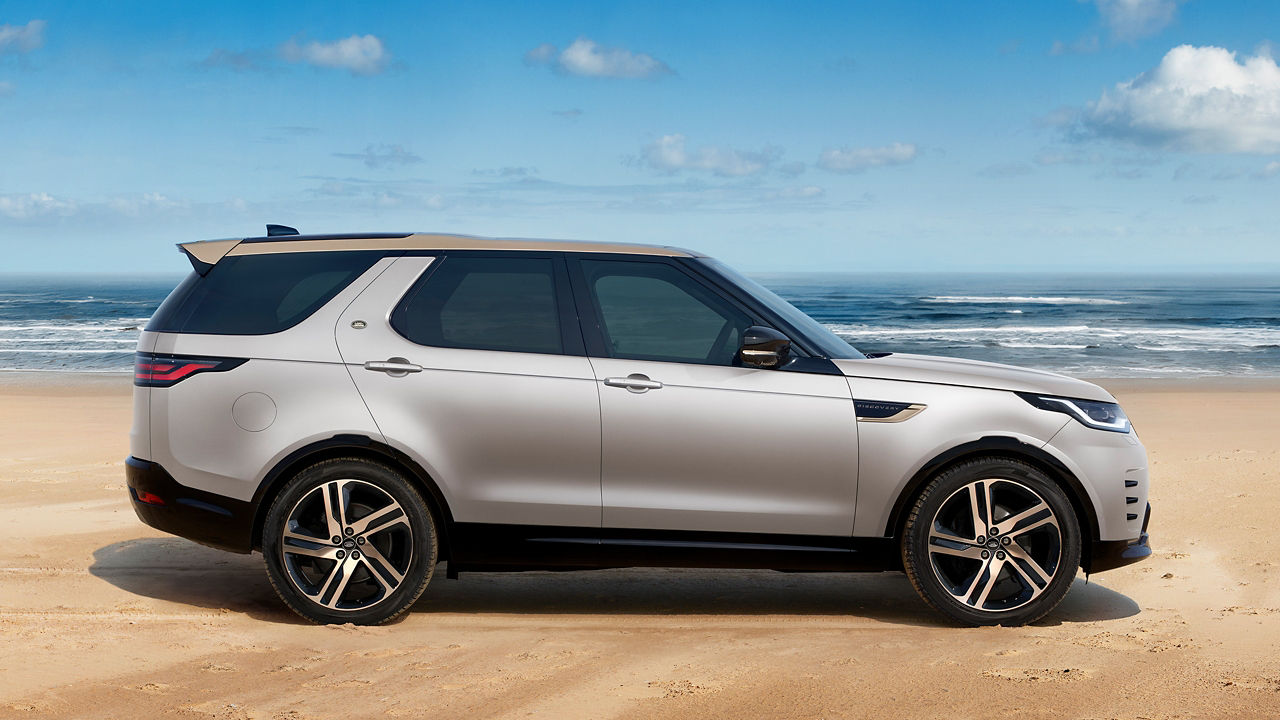 Discovery parked on seashore side view