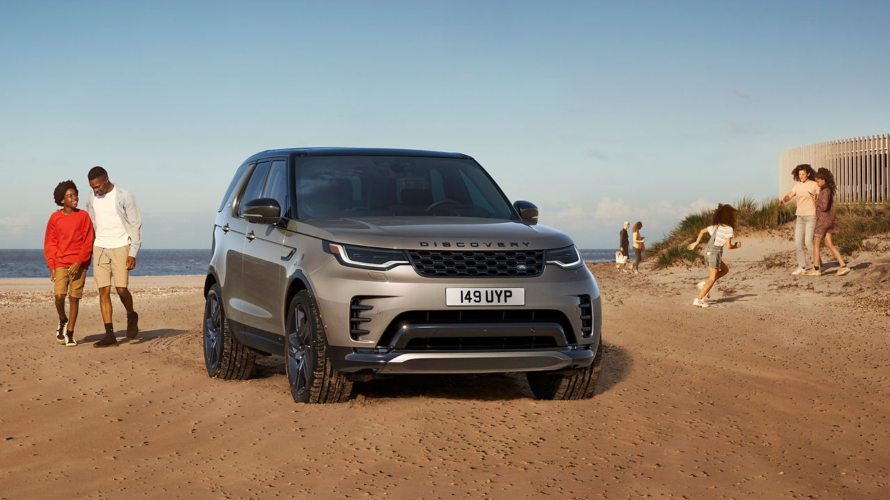 Family Picnic On A Beach Side With Discovery