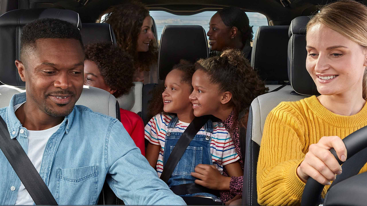 Family driving in Range Rover vehicle