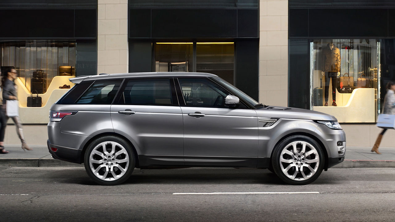 Parked Range Rover infront of Building