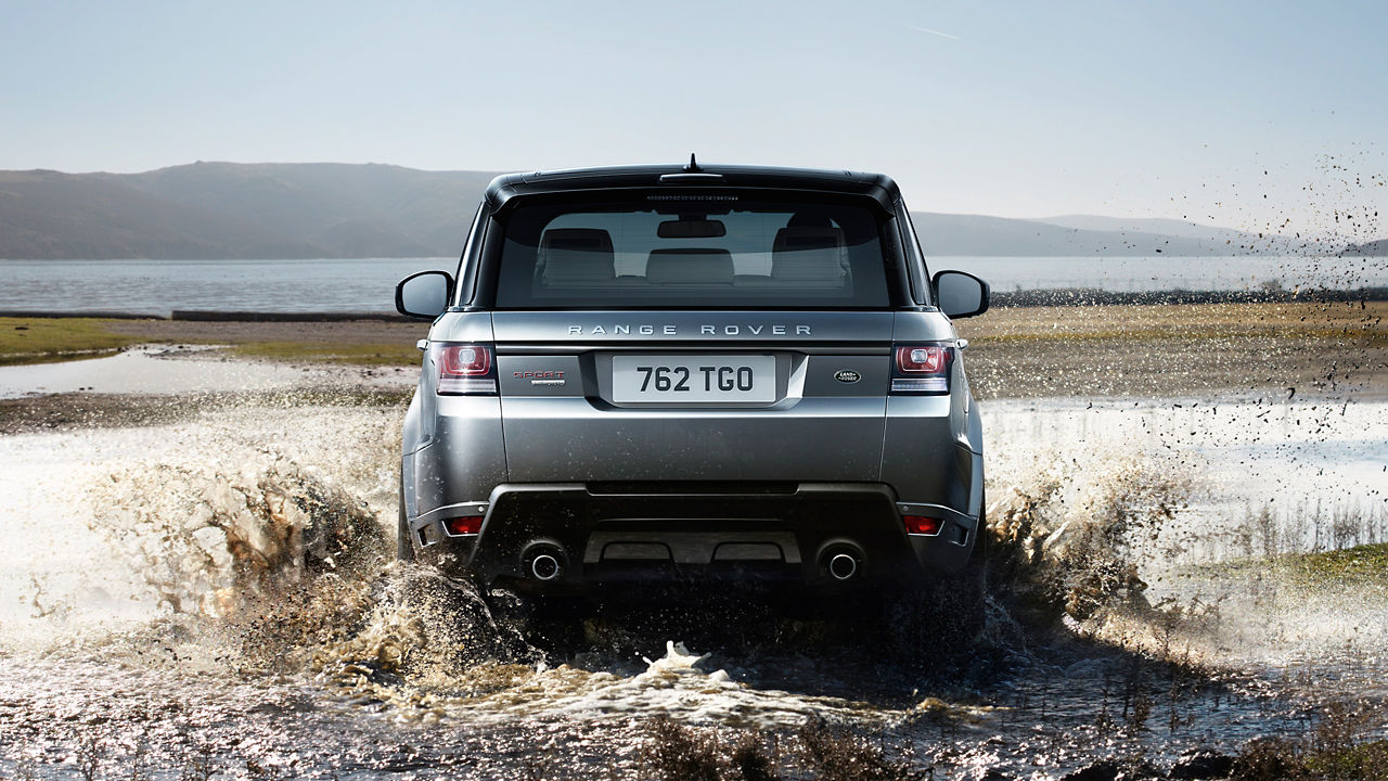 Range Rover  running in muddy water