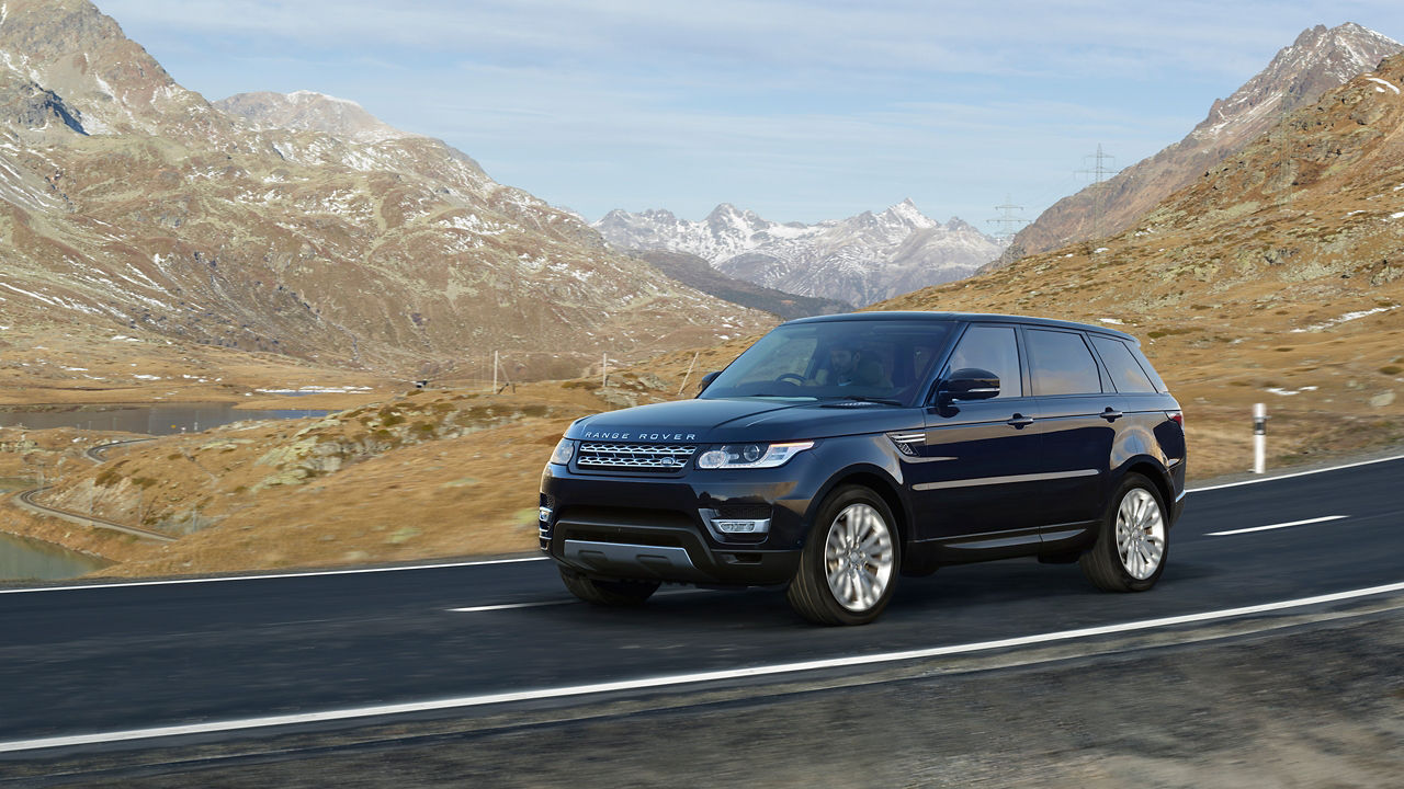 Range rover moving on mountain road