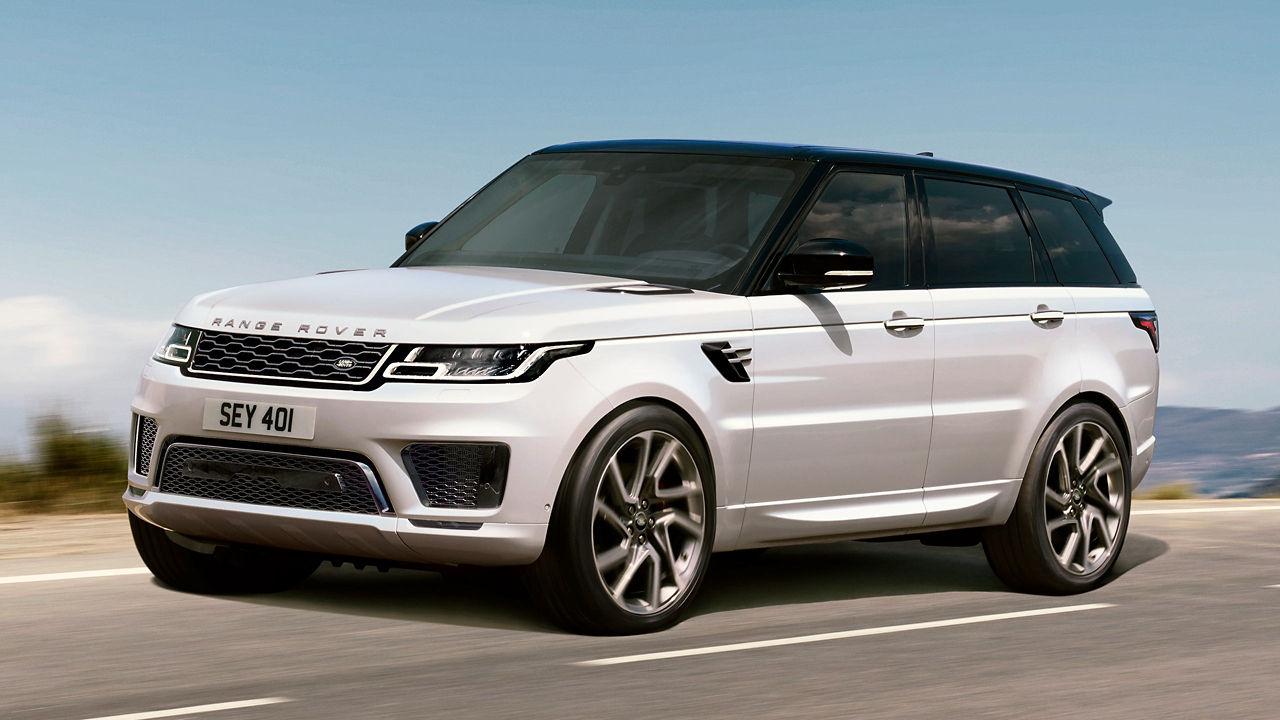 White Color Range Rover Sport Running on Hill Road